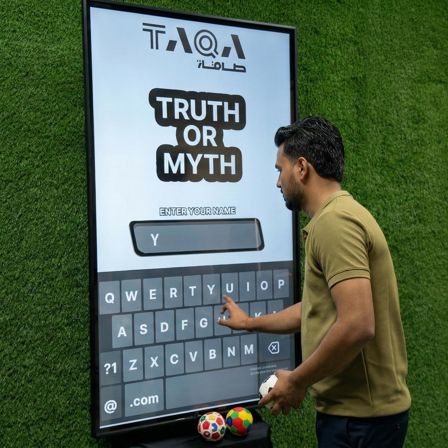 A guest throwing a softball at a large digital Truth or Myth display screen to lock in an answer at a high-energy corporate exhibition booth activation